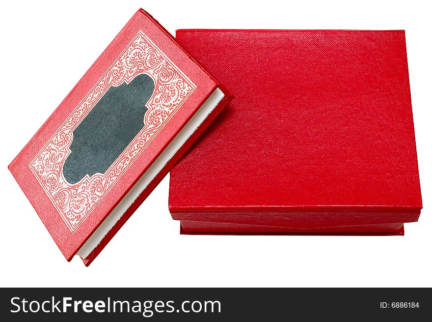 Red cover book with golden ornament in red box.