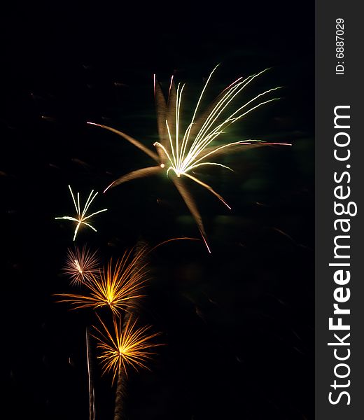 Bright colored fireworks on black background