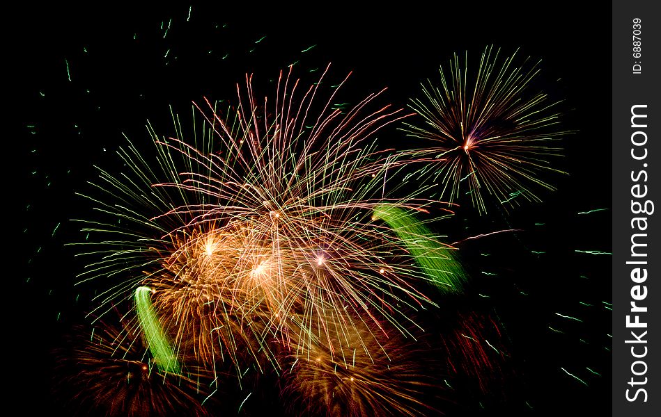 Bright colored fireworks on black background