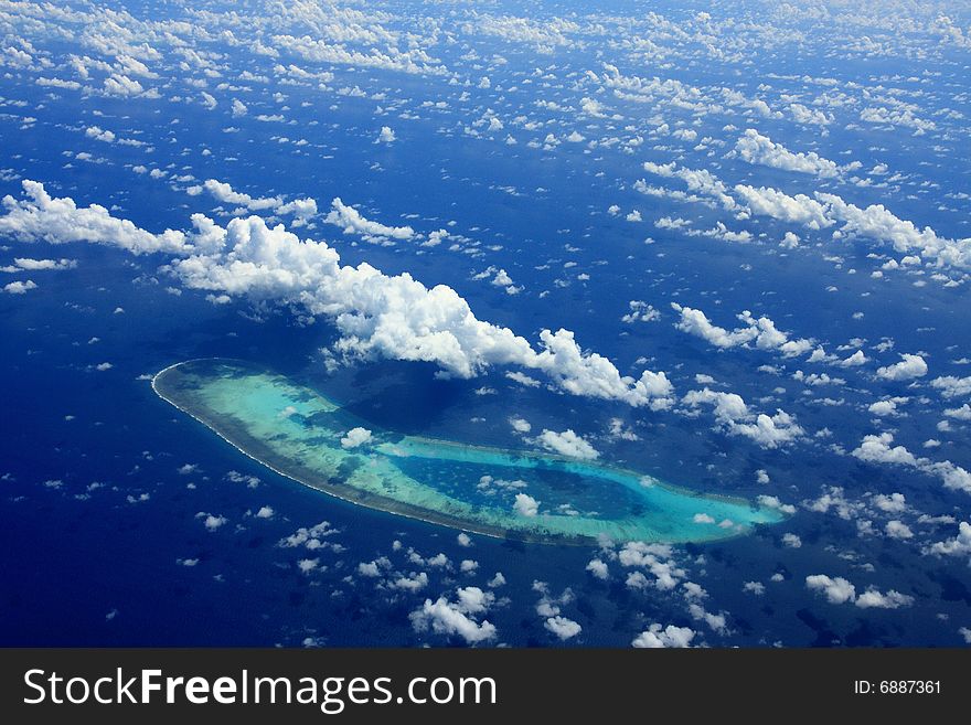 Blue sky, blue ocean, and coralline island in western pacific ocean. Blue sky, blue ocean, and coralline island in western pacific ocean