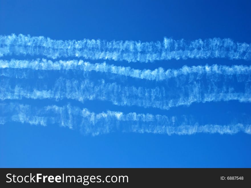 Traces in blue sky after acrobatic flight. Traces in blue sky after acrobatic flight