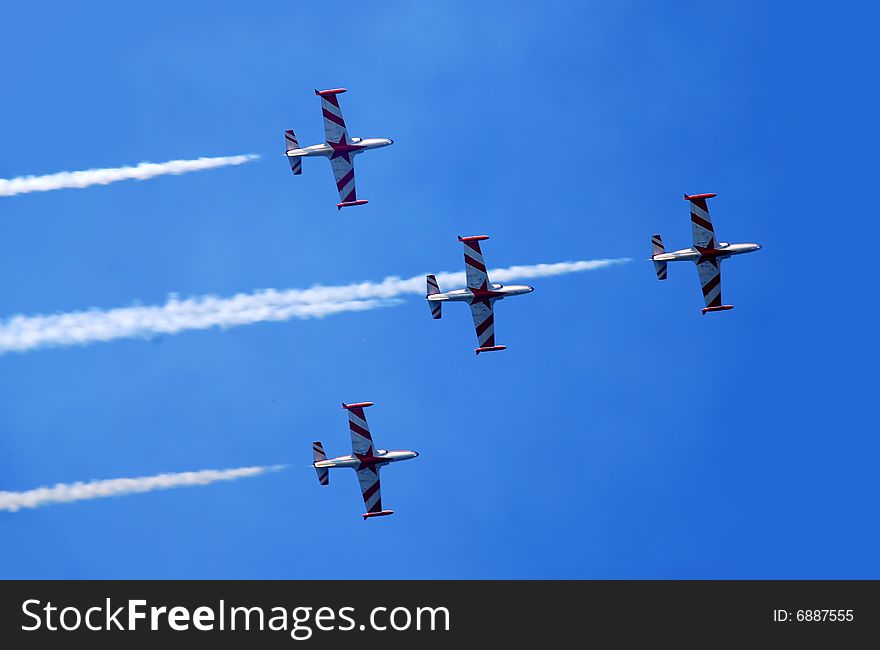 Flying plane formation with smoke trace over blue sky. Flying plane formation with smoke trace over blue sky