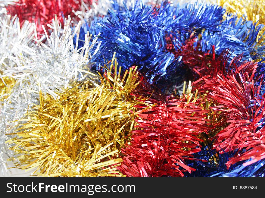 Red, yellow, dark blue and silvery ornaments on a New Year tree. Red, yellow, dark blue and silvery ornaments on a New Year tree