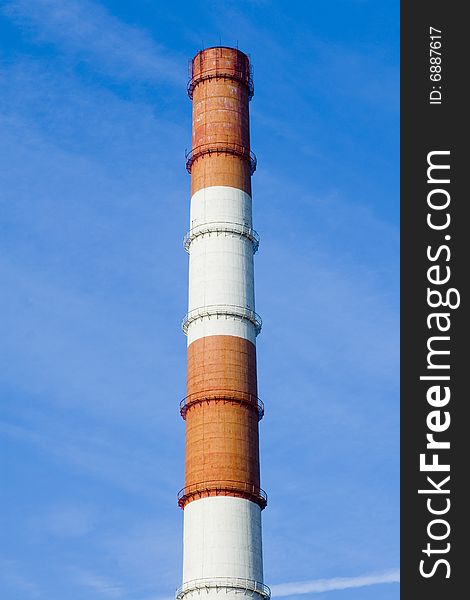 Red and white pipe on blue sky