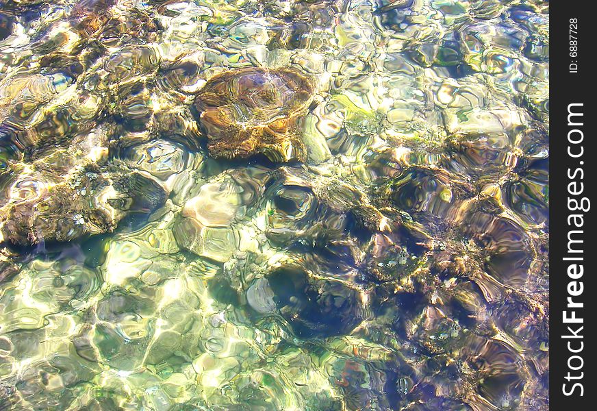 Clear transparent water surface with sun reflection. Clear transparent water surface with sun reflection