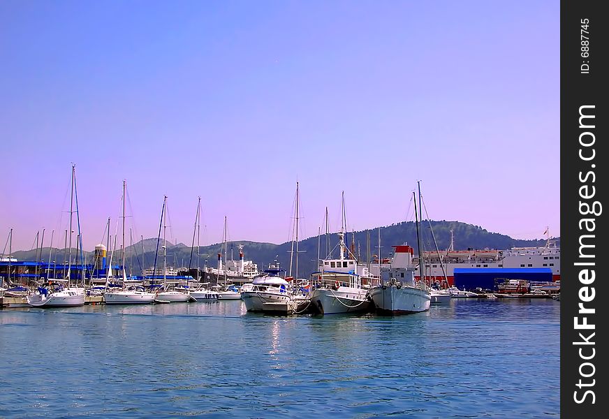 Several yachts on tranquil green Adriatic sea water in Montenegro. Several yachts on tranquil green Adriatic sea water in Montenegro