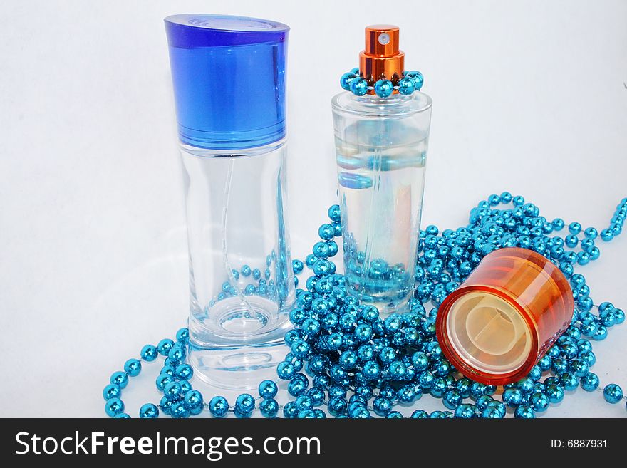 Perfumery water is decorated by a dark blue beads. Perfumery water is decorated by a dark blue beads
