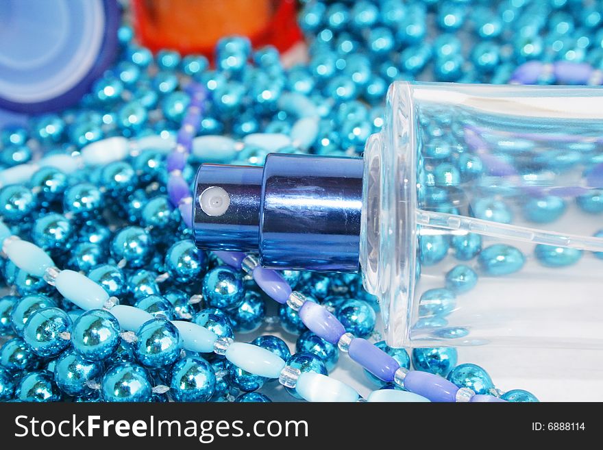 Perfumery water is decorated by a dark blue beads. Perfumery water is decorated by a dark blue beads