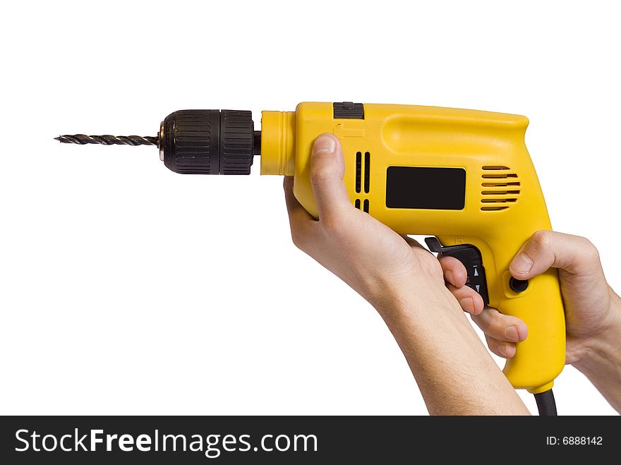Hands holding an yellow drill in a white background