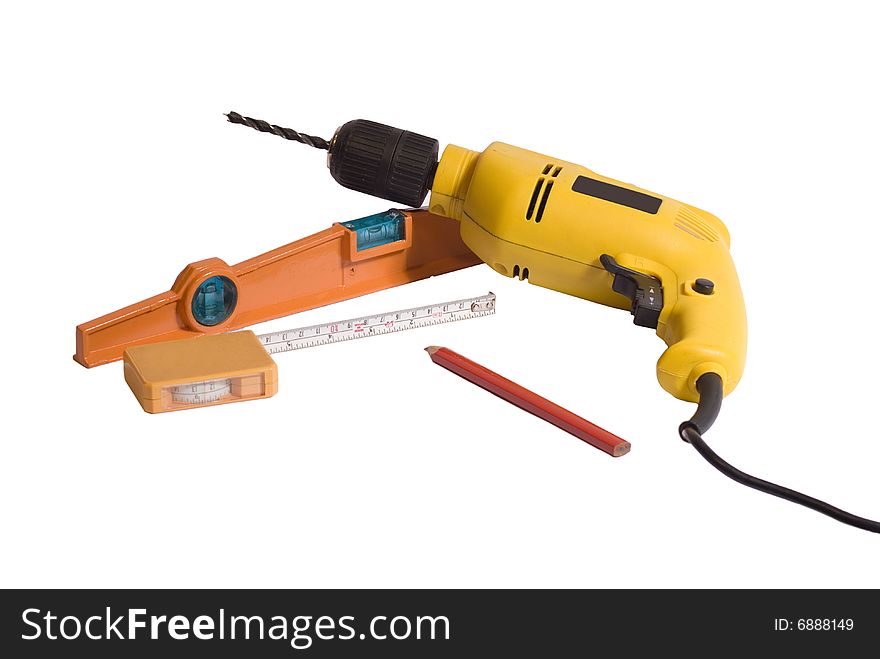 Drill, level, measuring tape and pencil in a white background. Drill, level, measuring tape and pencil in a white background