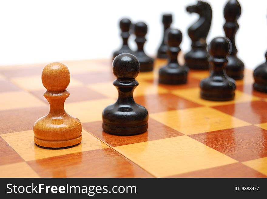 One white pawn fights against black army on chess board.