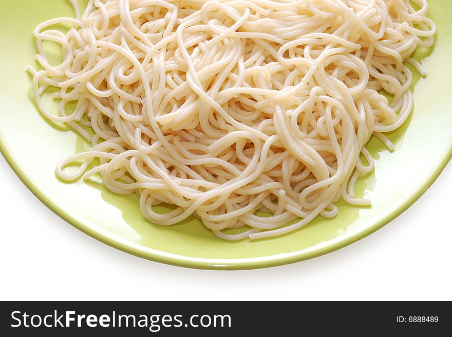 Italian spaghetti on green plate