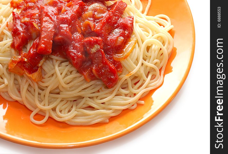 Spaghetti with meat in ketchup on orange plate