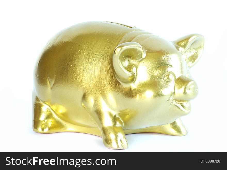 Golden piggy bank isolated on white