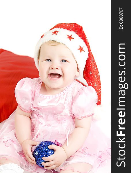 Baby in red hat on white ground. Baby in red hat on white ground