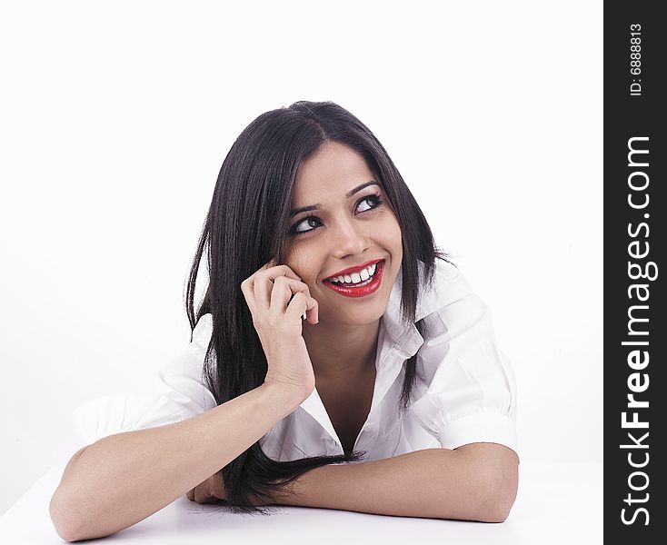 An attractive asian lady talking on the cell phone. An attractive asian lady talking on the cell phone