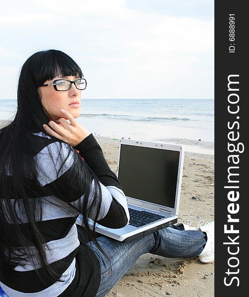 Woman On Beach With Laptop