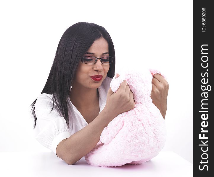 A pretty asian girl playing her pink teddy bear