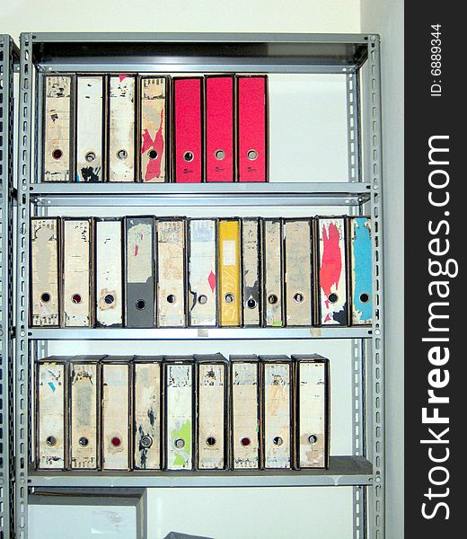 Coloured file folders in office cabinet