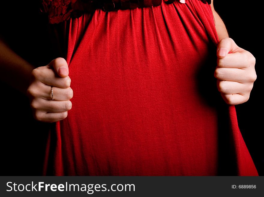 Slim finger gesture on fresh red skirt. Slim finger gesture on fresh red skirt