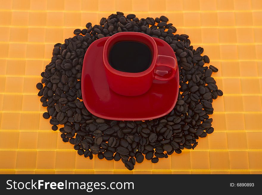 Red cup with coffee beans, coffee symbolizes flavor of fresh coffee