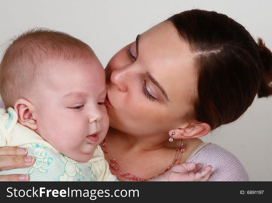 Smiling Mother and Baby on a white background. Smiling Mother and Baby on a white background