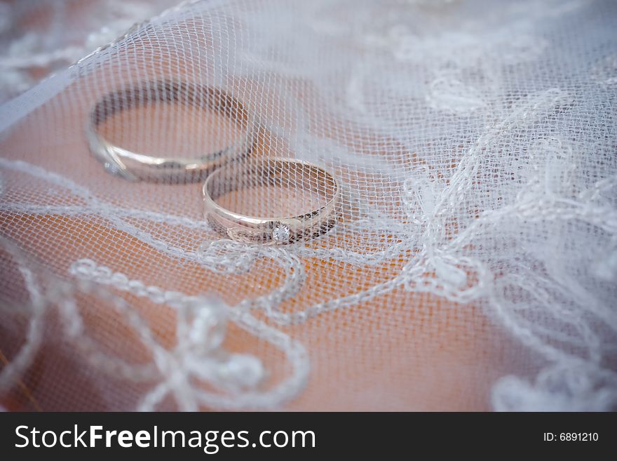 Wedding rings under the beautiful bridal lace. Wedding rings under the beautiful bridal lace