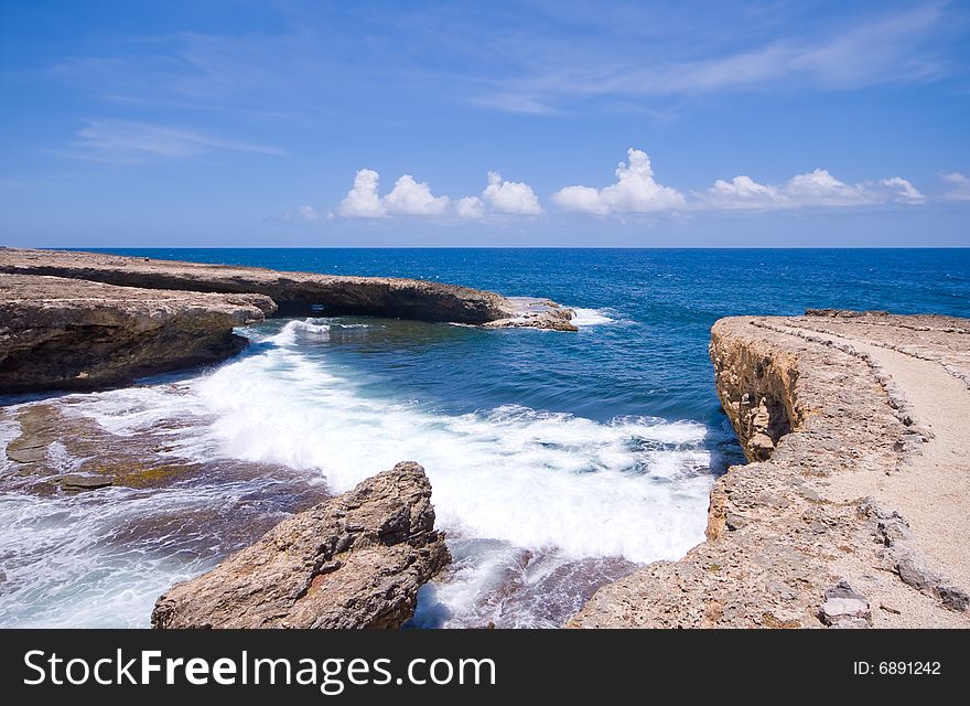 Tropical shore inlet with nice waves. Tropical shore inlet with nice waves