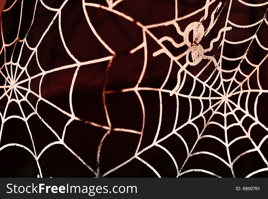 Stylized spider web with reddish tint