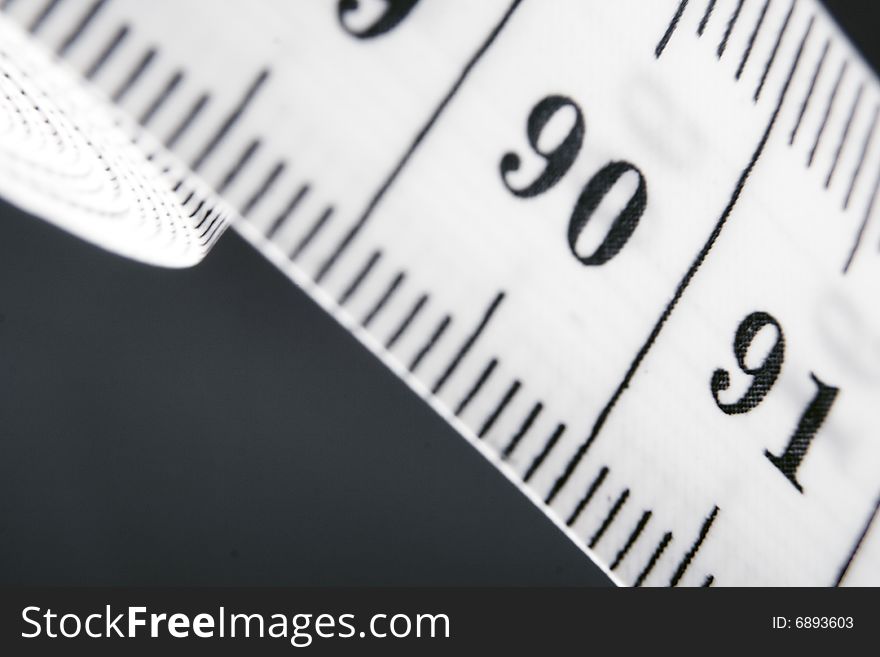 Measuring tape isolated on grey. Measuring tape isolated on grey.
