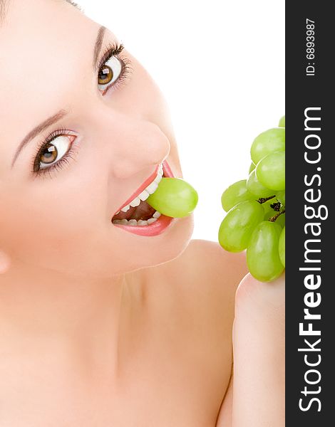 Pretty woman with green grape isolated on the white background