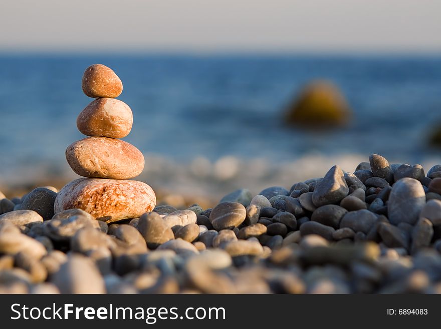 Balanced stones on the sea