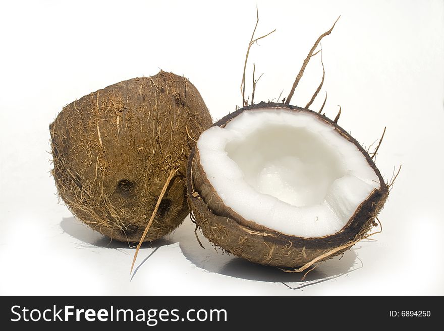Broken coconut isolated on a white background