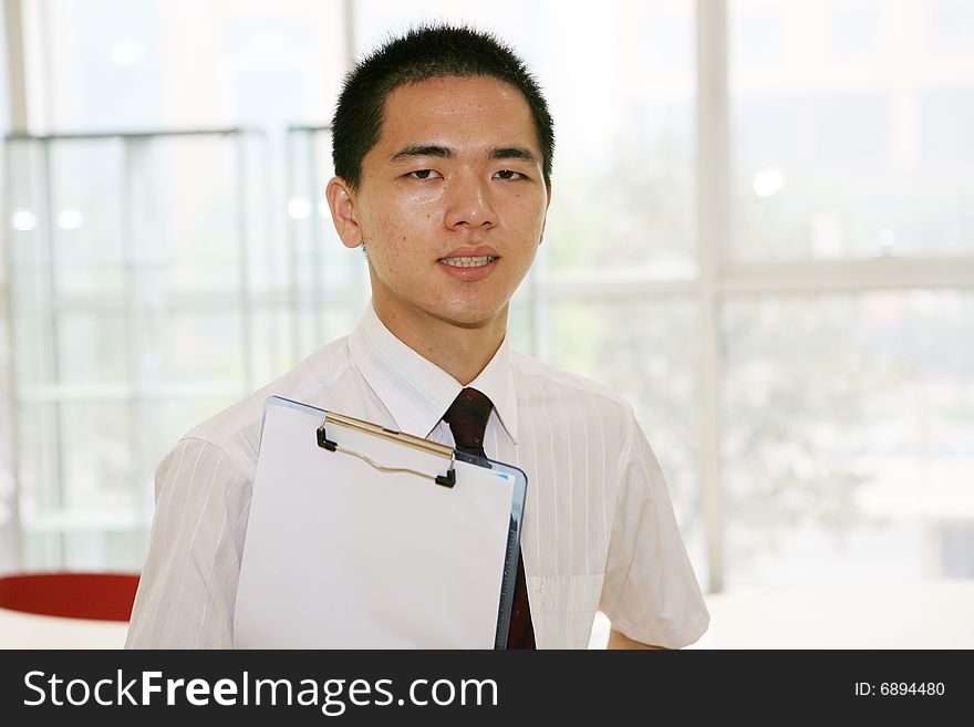 A young asian working in office