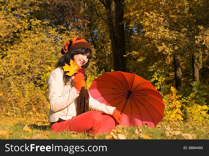 Young pretty woman in the autumn park. Young pretty woman in the autumn park