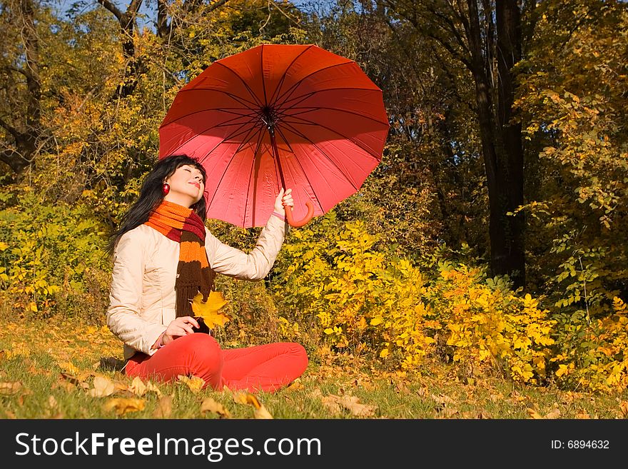 Young pretty woman in the autumn park. Young pretty woman in the autumn park