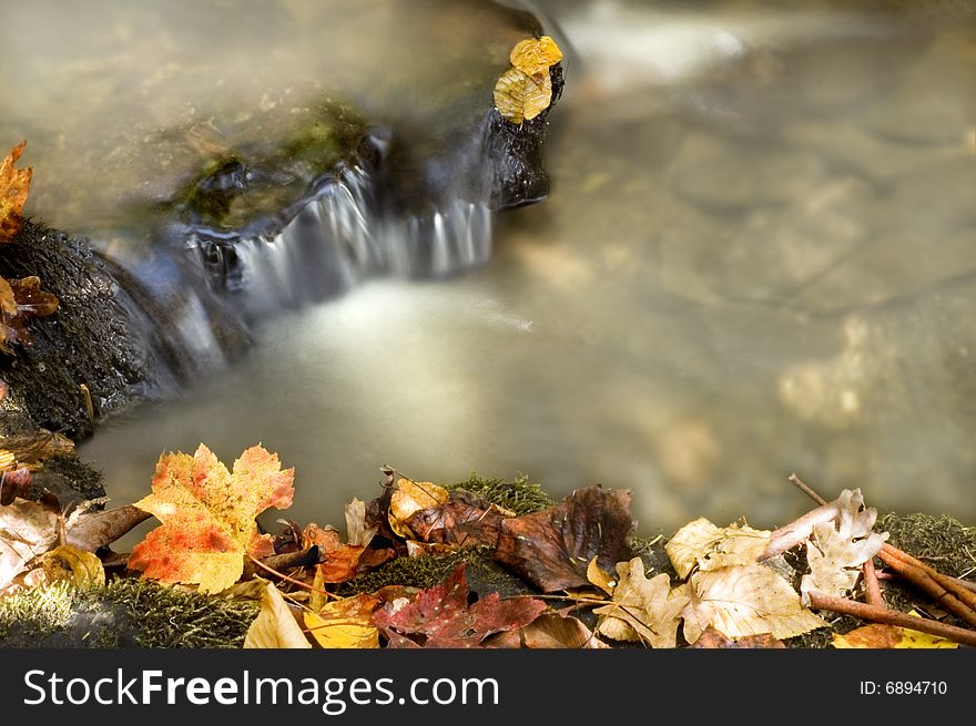 Autumn waterfall with lots of copy space