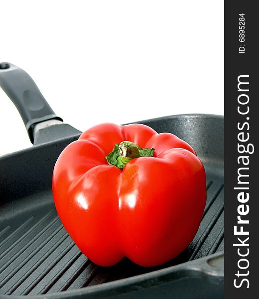 Detail of the red paprica in the frying pan with slant stripes. Detail of the red paprica in the frying pan with slant stripes.