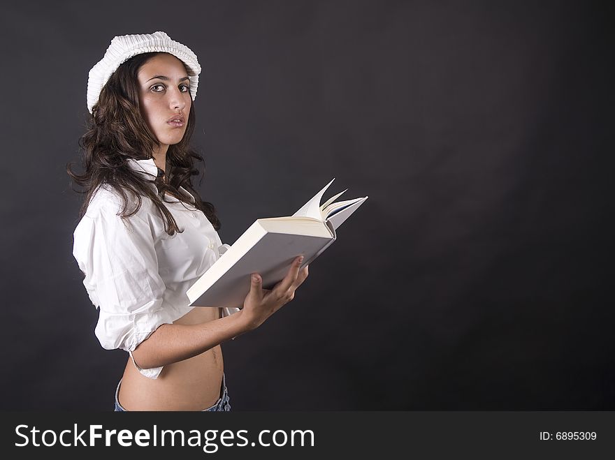 Beautiful Woman Reading A Book Isolated In Black