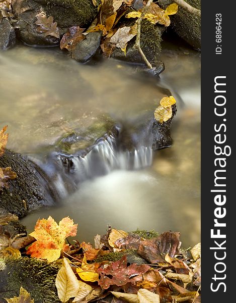 Autumn waterfall with lots of copy space