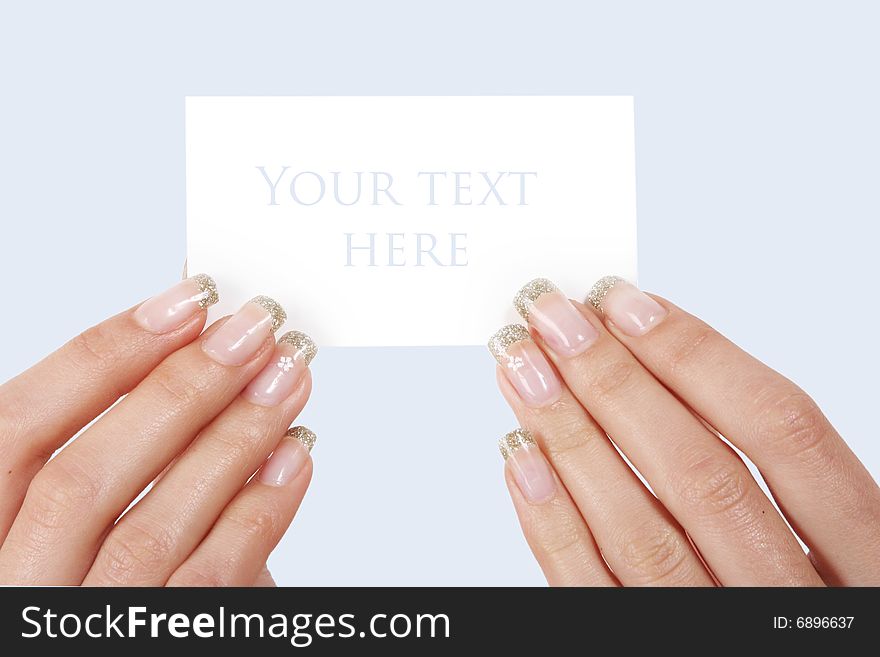 Woman holding card on blue background
