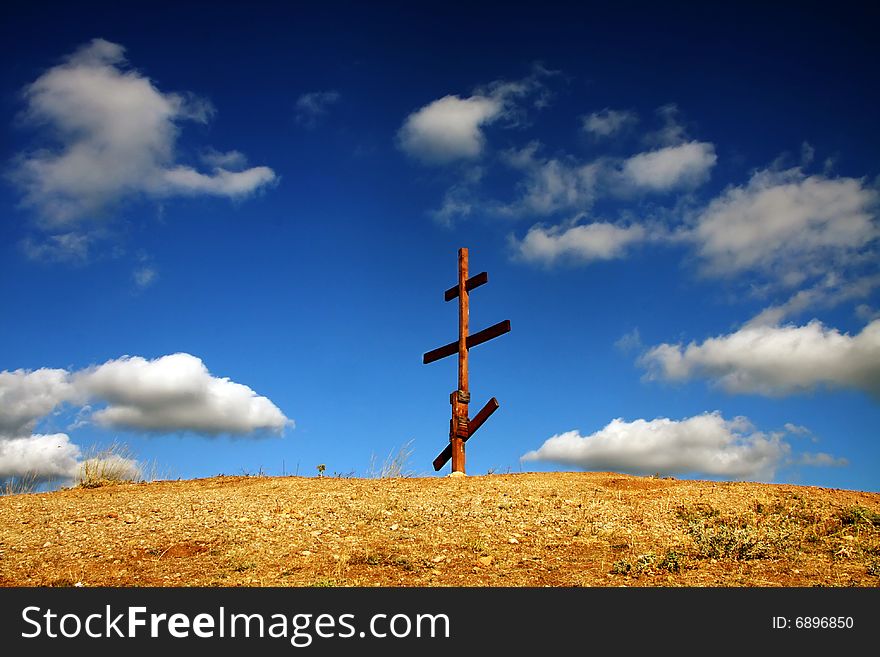 Eight-pointed [Russian] cross in mountains. Eight-pointed [Russian] cross in mountains