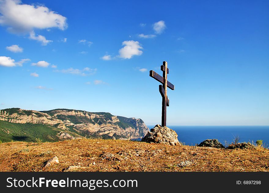 Eight-pointed [Russian] cross in mountains. Eight-pointed [Russian] cross in mountains