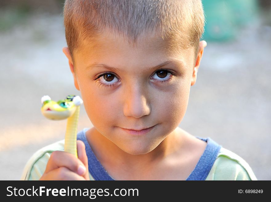 Kid With A Small Toy