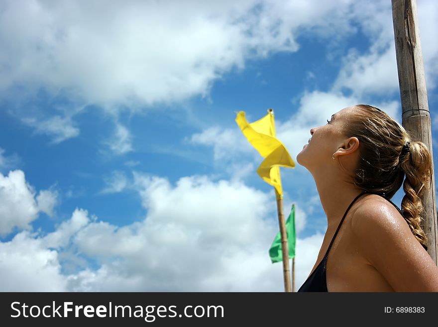 A girl looking up in the sky with flags
