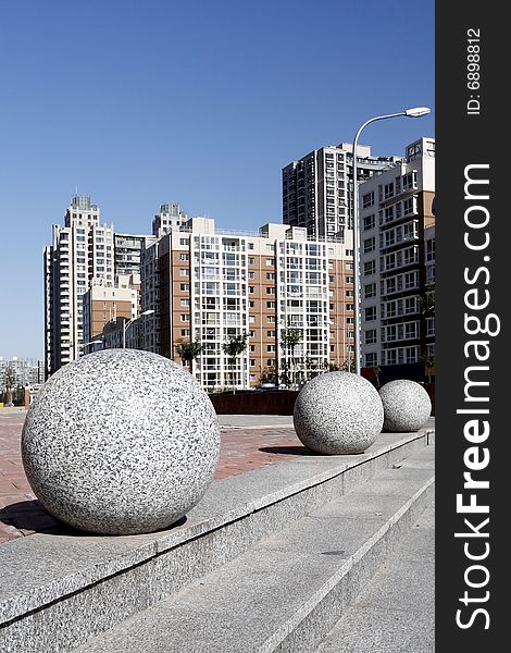 Stone balls on the ground in a residential area of Beijing, China. Stone balls on the ground in a residential area of Beijing, China.