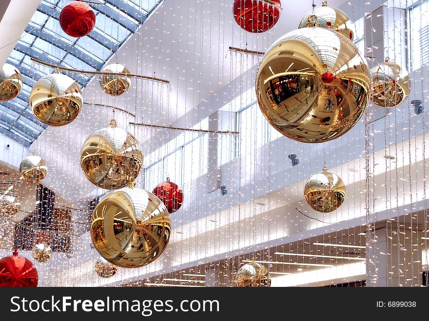 New Year's decorations in the malls, in the central part. Decorations hang ceiling.