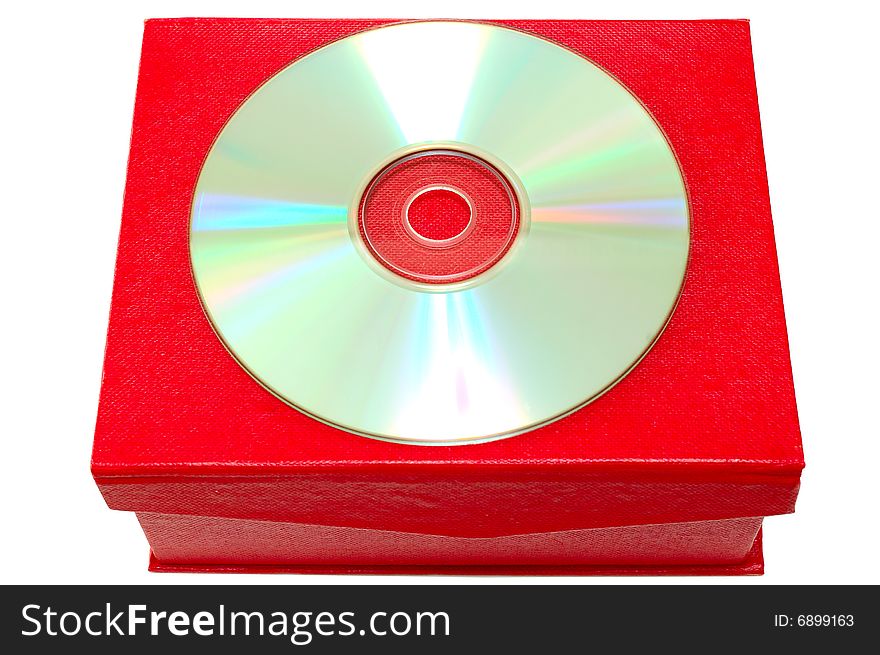 Compact-disk (CD or DVD) and red cardboard box on isolated background. Compact-disk (CD or DVD) and red cardboard box on isolated background.