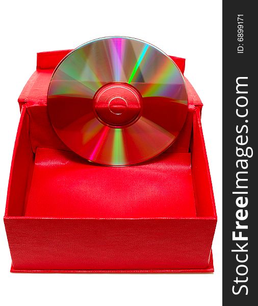 Compact-disk (CD or DVD) and red cardboard box on isolated background. Compact-disk (CD or DVD) and red cardboard box on isolated background.