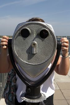 Woman Looking Through A Coin Operated Binoculars Stock Photography Woman Looking Through A Coin Operated Binoculars Stock Photography